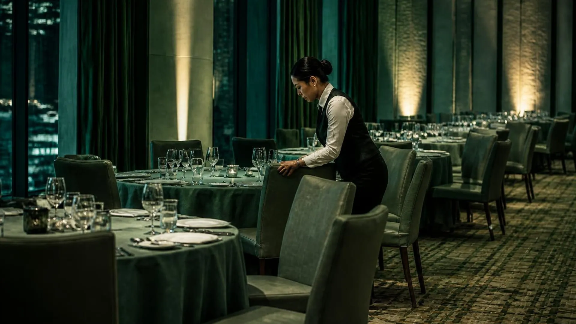 A Gorkha Group attendant preparing a restaurant floor for service in Dubai